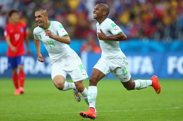 Yacine Brahimi (right) celebrates a classic goal to secure all three points for Algeria. (Getty Images)