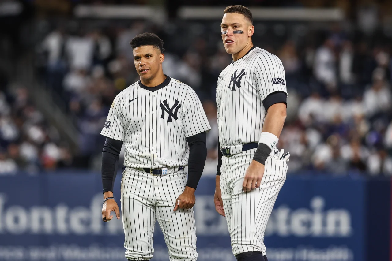 New York Yankees right fielder Juan Soto (22) and center fielder Aaron Judge (99) wait to go back onto the field in the third inning against the Toronto Blue Jays at Yankee Stadium.